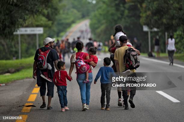 Migrants taking part in a caravan heading to the US, walk from Huixtla to Escuintla, Chiapas state, Mexico, on June 9, 2022. - Thousands of mostly...