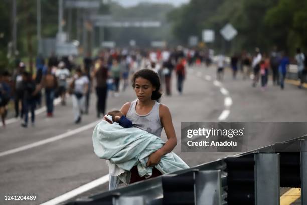 Female migrant is seen carrying her baby on the road at the migrant caravan in Huixtla, Chiapas in Mexico on June 09, 2022. The caravan from Huixtla...