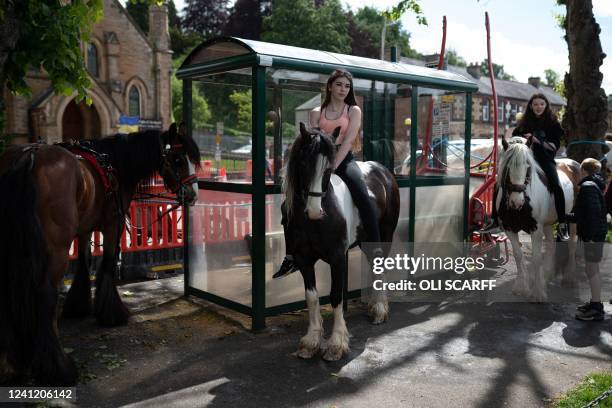 People attend the first day of the annual Appleby Horse Fair, in the town of Appleby-in-Westmorland, north west England on June 9, 2022. The annual...
