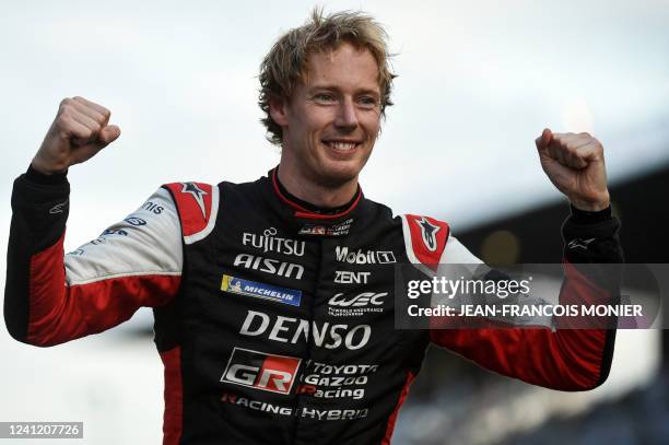 New Zeland's driver Brendon Hartley celebrates as he receives the Hyperbole trophy after the Hyperpole practice session on his Toyota GR010 Hybrid...