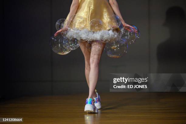 Model presents a creation by Lin Mengyao as part of a collection entitled 'Sweet Tooth' during a fashion show entitled 'Unbound', showcasing final...
