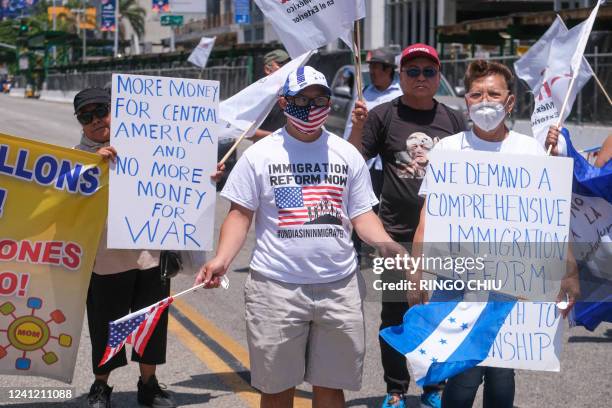 People protest for immigration reform outside the Convention Center during the 9th Summit of the Americas in Los Angeles, California, June 9, 2022.