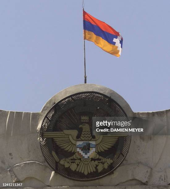 "Yerakuyn", the Nagorny-Karabakh flag flies 18 June 2000 over the "presidency" in Stepanakert, the capital of the disputed Azerbaijan territory of...