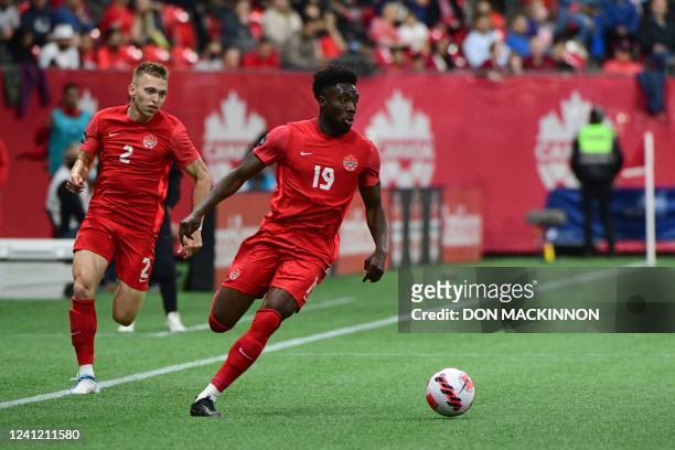 Canada's midfielder Alphonso Davies controls the ball during the Concacaf Nations League football match between Canada and Curacao at BC Place...