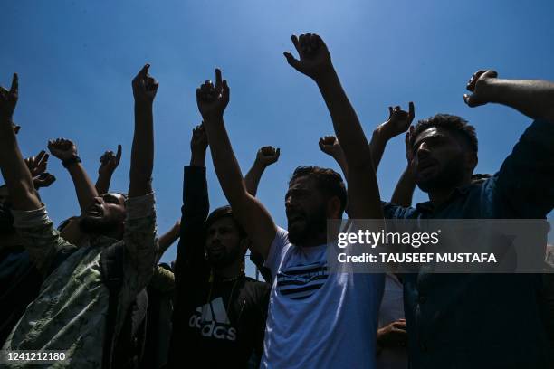 Kashmiri traders shout Islamic slogans during a protest in Srinagar on June 10, 2022. - A spontaneous strike was observed in Srinagar to protest...