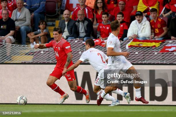 Steven Zuber of Switzerland, Cesar Azpilicueta of Spain and Marcos Llorente of Spain battle for the ball during the UEFA Nations League League A...