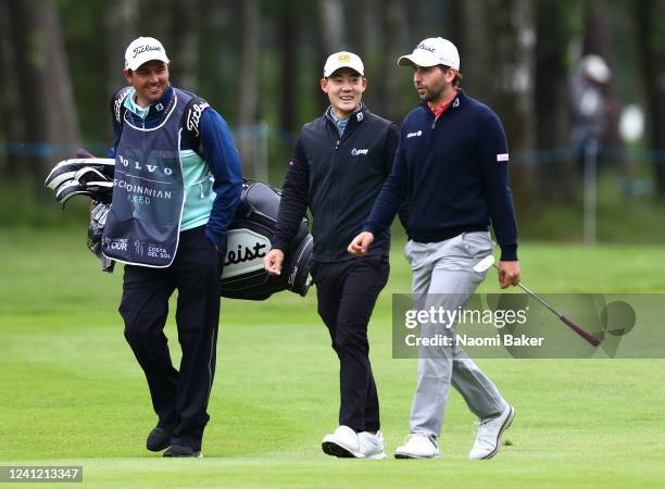 Nicolai Von Dellinghausen of Germany and Jazz Janewattananond of Thailand walk to the 3rd hole during Day Two of the Volvo Car Scandinavian Mixed...