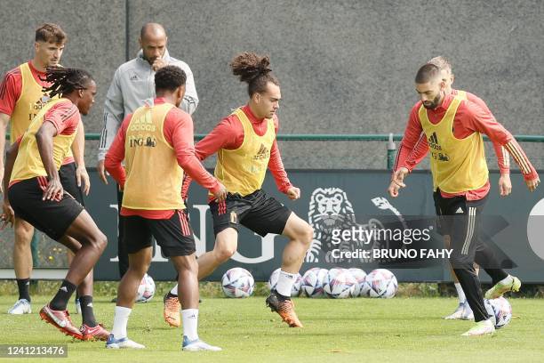 Belgium's Arthur Theate and Belgium's Yannick Carrasco fight for the ball during a training session of the Belgian national team, the Red Devils,...