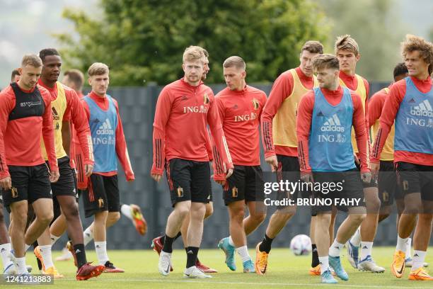 Belgium's Kevin De Bruyne warms up with teammates during a training session of the "Red Devil" national football team in Tubize, on June 10 in...