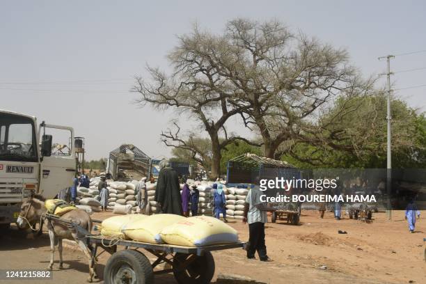 Vendors cell goods at a market in the town of Téra, southwestern Niger, near Burkina Faso, on June 9, 2022. - Nigerien President Mohamed Bazoum...