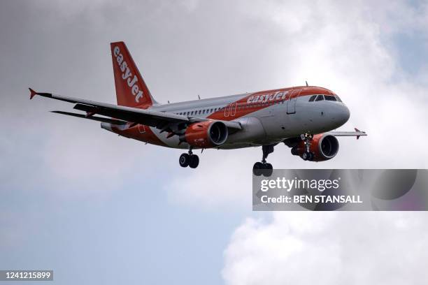 Am Easyjet passenger jet comes in to land at Gatwick Airport, south of London on June 10, 2022. EasyJet is to offer new and existing cabin crew a...