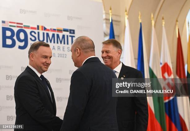 Polish President Andrzej Duda welcomes Bulgarian President Rumen Radev next to Romanian President Klaus Iohannis ahead the "B9 Summit" in Bucharest,...