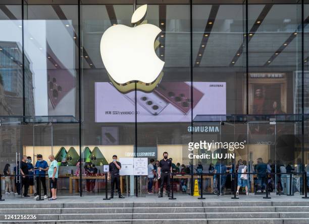 People visit an Apple Store in Shanghai on June 10 as Shanghai will carry out a city wide Covid-19 testing in the coming weekend. - China OUT / China...