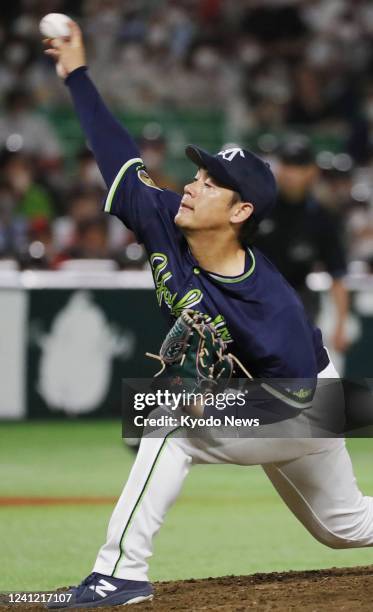 Yasuhiro Ogawa of the Yakult Swallows throws a pitch during an interleague baseball game against the SoftBank Hawks at PayPay Dome in Fukuoka,...