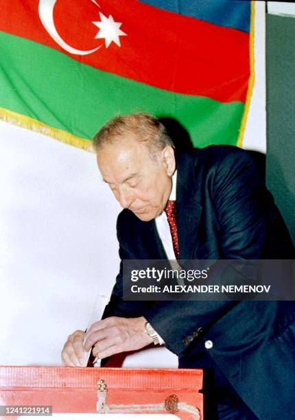 Azeri President Geidar Aliyev at a local polling station casts his vote during the presidential elections in Baku, 11 October 1998. According to the...