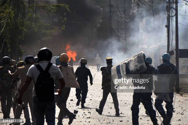 Protestors clash with Indian Security personnel during a protest over insulting remarks against Prophet Muhammad by some officials of the Indian...