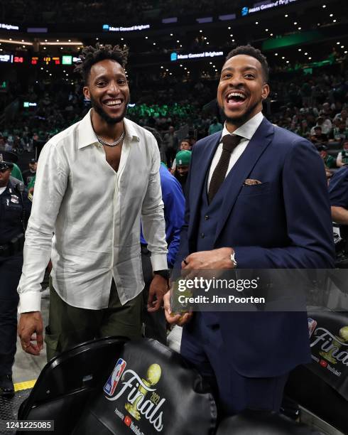 Former player, Evan Turner poses for a photo with CJ McCollum of the New Orleans Pelicans during Game Three of the 2022 NBA Finals on June 8, 2022 at...