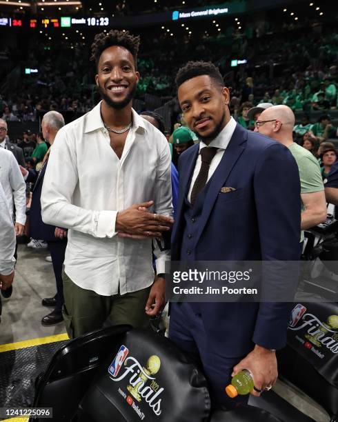 Former player, Evan Turner poses for a photo with CJ McCollum of the New Orleans Pelicans during Game Three of the 2022 NBA Finals on June 8, 2022 at...