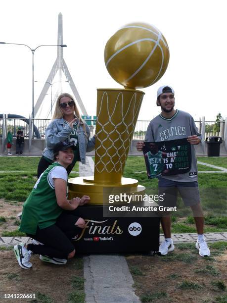 Boston Celtics fans poses with the NBA trophy prior to Game Four of the 2022 NBA Finals on June 10, 2022 at the TD Garden in Boston, Massachusetts....