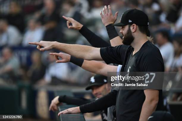 Lucas Giolito of the Chicago White Sox and other White Sox players point from the dugout during the second inning against the Texas Rangers at...