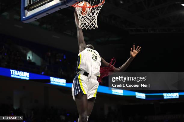 Awak Kuier of the Dallas Wings dunks the ball during the game against the Seattle Storm on June 10, 2022 at College Park Center in Arlington, TX....