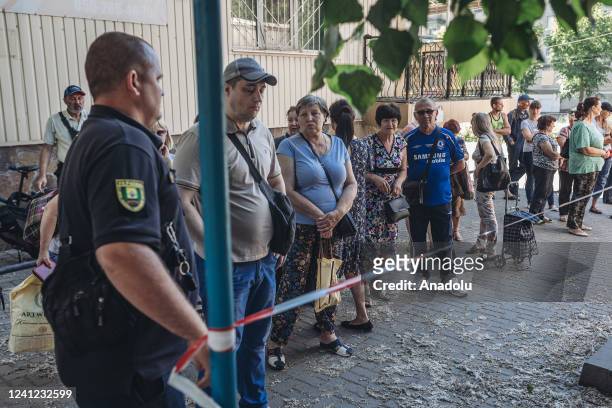 Neighbours wait for humanitarian aid in Bakhmut city in the Donetsk Oblast, Ukraine on June 10, 2022.