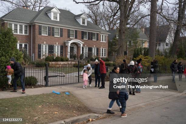 People visit the house featured in the movie "Home Alone" in Winnetka, Illinois on Nov. 27, 2021.