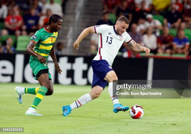 United States forward Jordan Morris dribbles past Grenada midfielder Romar Frank during a Concacaf Nations League match on June 10, 2022 at Q2...