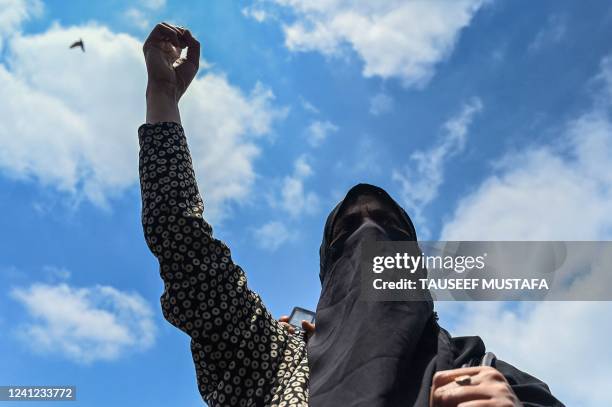 Kashmiri woman shouts Islamic slogans during a protest against India's Bharatiya Janata Party former spokeswoman Nupur Sharma over her remarks about...