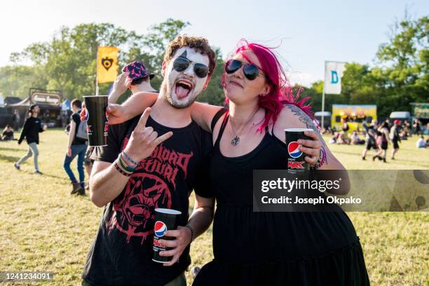 Festival goers get face paint to look like KISS on Day 1 of Download festival at Donnington Park on June 10, 2022 in Donnington, England.