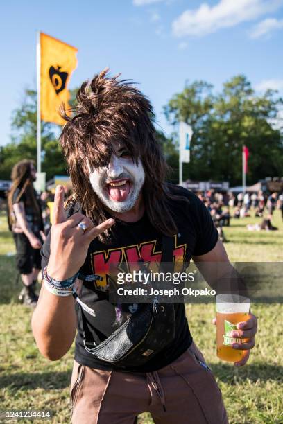 Festival goers get face paint to look like KISS on Day 1 of Download festival at Donnington Park on June 10, 2022 in Donnington, England.