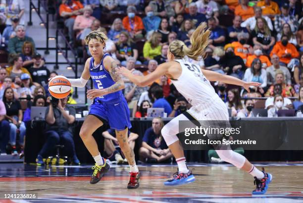 Connecticut Sun guard Natisha Hiedeman defended by Chicago Sky guard Julie Allemand during the WNBA game between Chicago Sky and Connecticut Sun on...