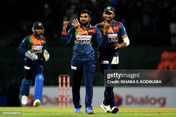 Sri Lanka's Wanindu Hasaranga celebrates with teammates after taking the wicket of Australia's Glenn Maxwell during the third and final Twenty20...