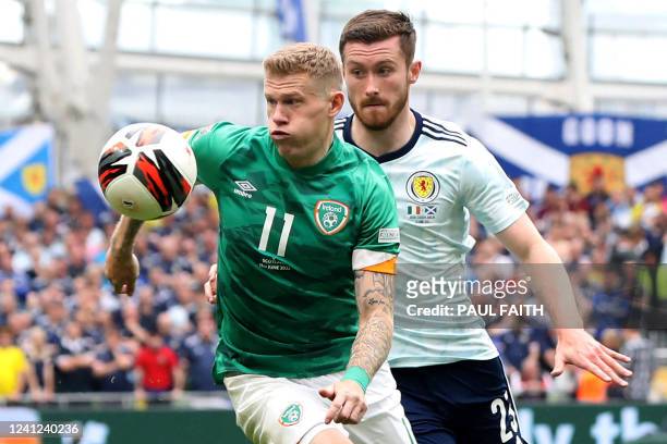 Republic of Ireland's midfielder James McClean vies with Scotland's defender Anthony Ralston during the UEFA Nations League, league B group 1...
