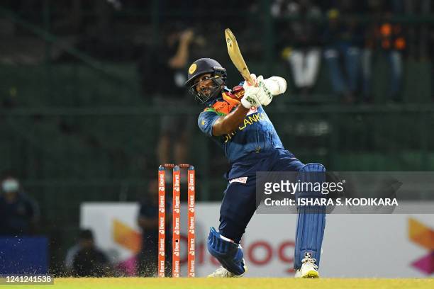 Sri Lanka's Chamika Karunaratne plays a shot during the third and final Twenty20 international cricket match between Sri Lanka and Australia at the...