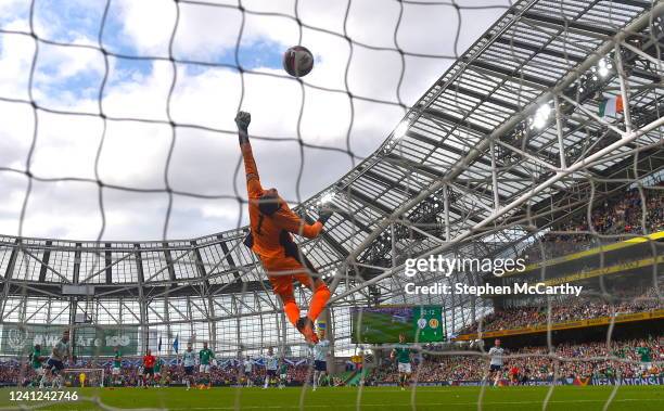 Dublin , Ireland - 11 June 2022; Scotland goalkeeper Craig Gordon fails to stop the shot at goal by Michael Obafemi of Republic of Ireland during the...