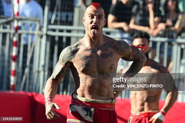 Red Team player celebrates after scoring during the Calcio Storico Fiorentino, a traditional 16th Century Renaissance ball game, at Piazza Santa...