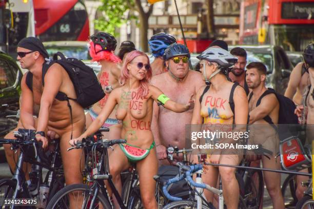 Nude cyclists pass through central London during this years World Naked Bike Ride. Thousands of nude and partially nude people took part in the World...