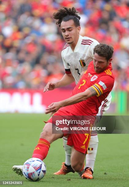 Welsh Joe Allen and Belgium's Arthur Theate fight for the ball during a soccer game between Wales and Belgian national team the Red Devils, Saturday...