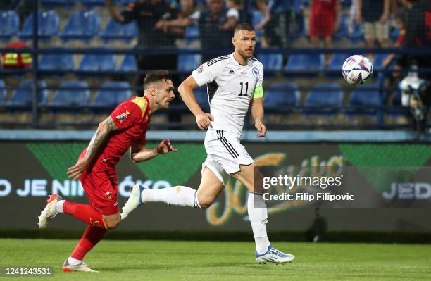 Edin Dzeko of Bosnia and Herzegovina and Marko Vesovic of Montenegro during the UEFA Nations League League B Group 3 match between Montenegro and...