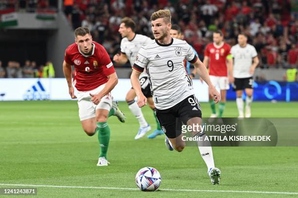 Germany's forward Timo Werner runs with the ball during the UEFA Nations League football match Hungary v Germany at the Puskas Arena in Budapest on...