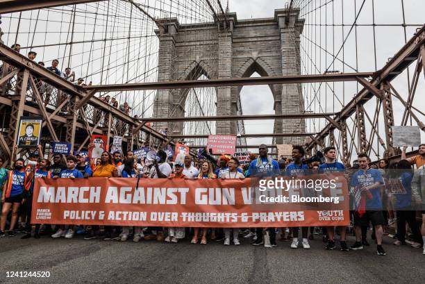 Demonstrators cross the Brooklyn Bridge during a March For Our Lives rally in New York, US, on Saturday, June 11, 2022. In the wake of the May...