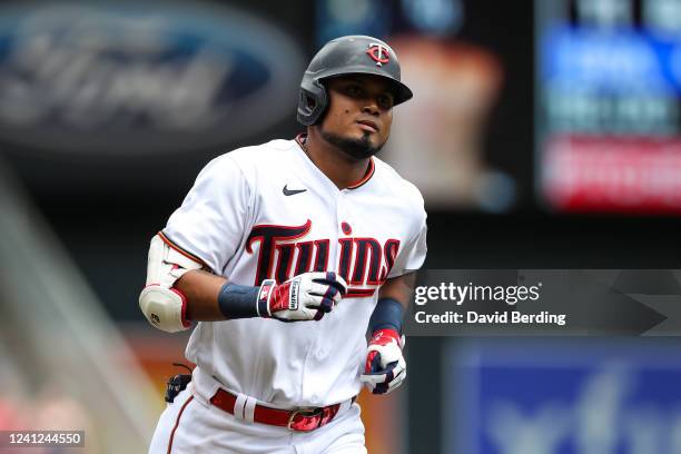 Luis Arraez of the Minnesota Twins rounds the bases on his first career grand slam against the Tampa Bay Rays in the third inning of the game at...