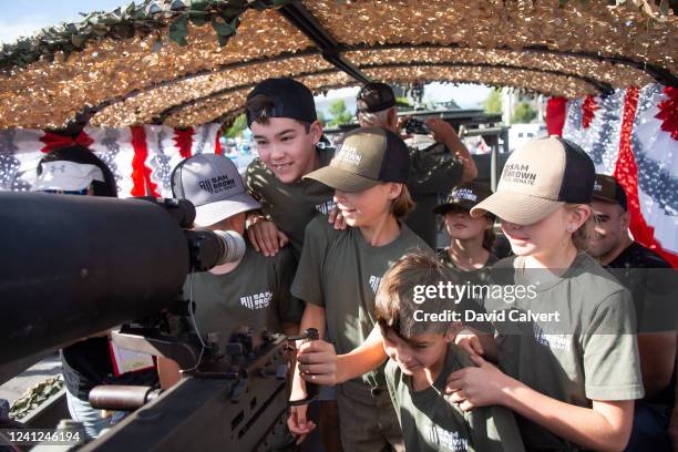 Kids check out a U.S. Army M925A1 gun truck during the Carson Valley Days parade at which Republican U.S. Senate candidate Sam Brown campaigned on...