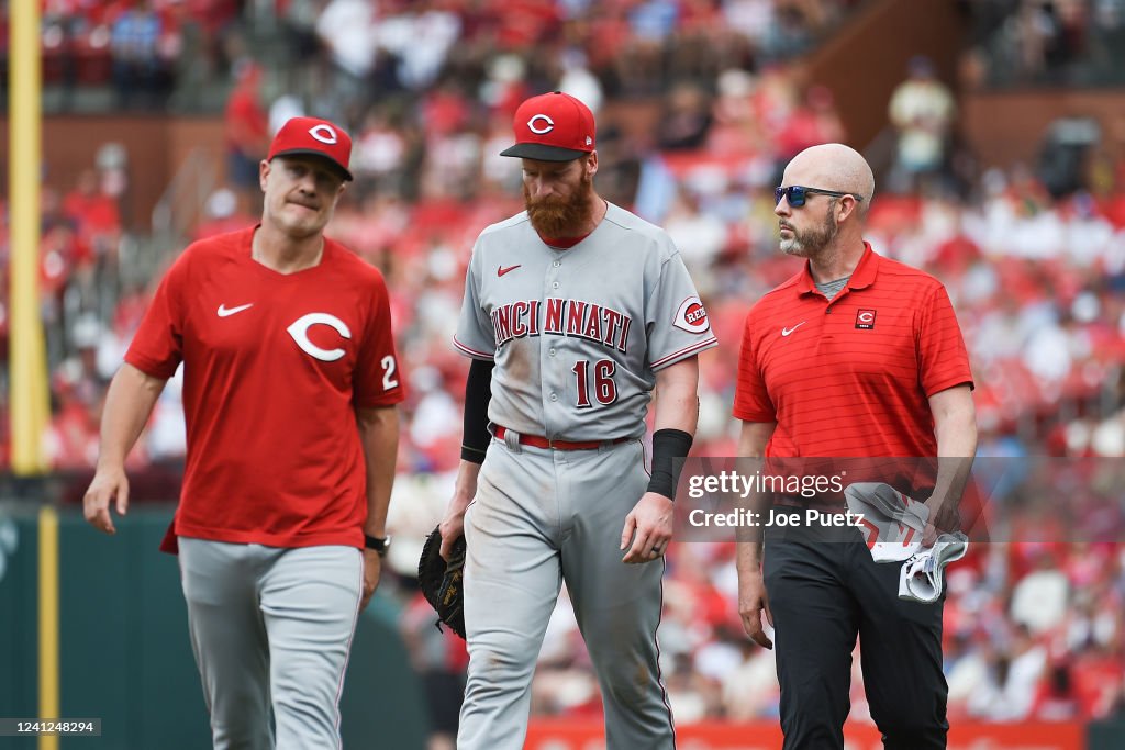 Cincinnati Reds Infield Colin Moran of the Cincinnati Reds walks off the field with manager ...