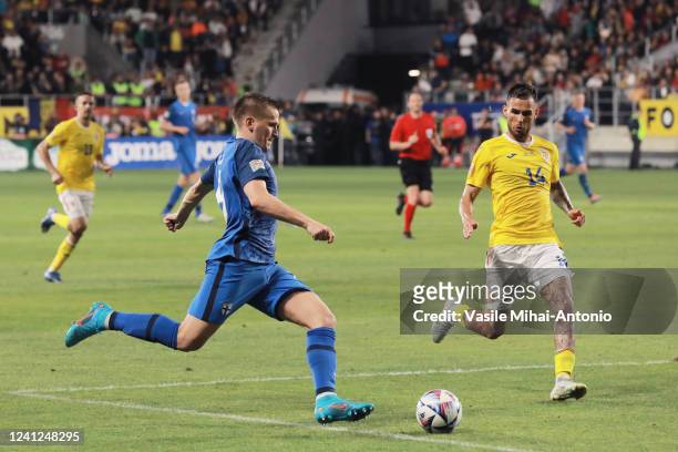 Robert Ivanov of Finland attempts to pass the ball during the UEFA Nations League -League B Group 3 match between Romania and Finland at Rapid...