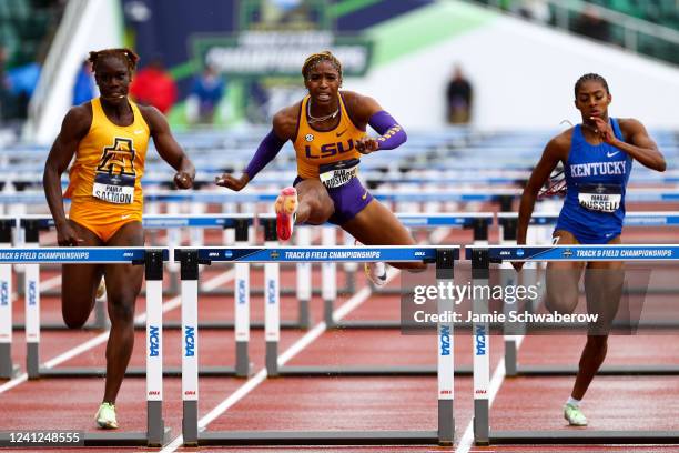 Paula Salmon of the North Carolina A&T Aggies, Alia Armstrong of the LSU Tigers and Masai Russel of the Kentucky Wildcats compete in the womens 100...