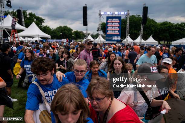 People panic and run after a man charged the main stage at the March for Our Lives rally on the National Mall near the Washington Monument on...