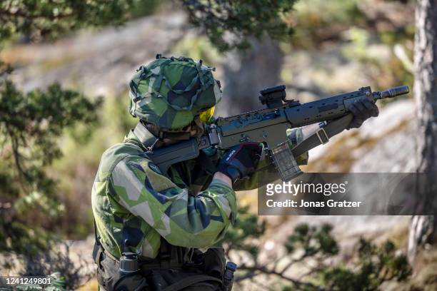 Soldier performs during the Baltic Operations NATO military drills on June 11, 2022 in the Stockholm archipelago, the 30,000 islands, islets and...