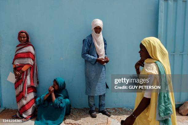 Malian refugees wait to be seen by a member of UNHCR at a registration centre in M'Berra Refugee Camp in Bassikounou on June 7, 2022. - M'Berra camp,...